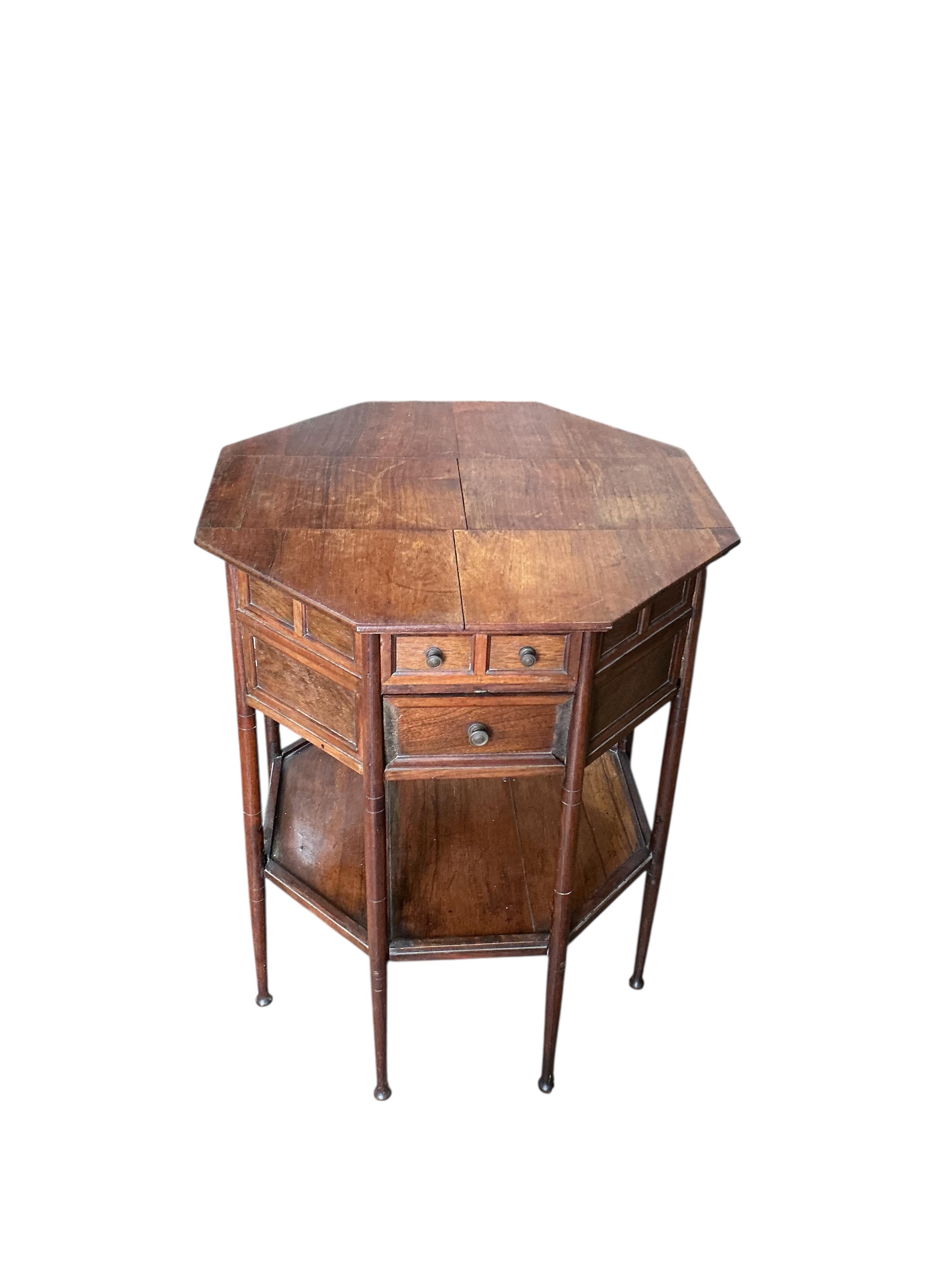 A late Victorian octagonal rosewood two tier work table, width 54cm, height 68cm